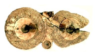 Ivory fibula (brooch) of the ‘spectacle’ type, height // cm, found on Timpone della Motta, 7th c. BC, National Archaeological Museum, Sibari. Ivory fibula (brooch) of the ‘spectacle’ type, height // cm, found on Timpone della Motta, 7th c. BC, National Archaeological Museum, Sibari.