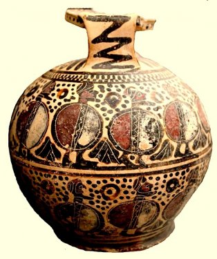 Large aryballos (flask for perfumed oil) decorated with two friezes of warriors, height 16 cm. Imported from Corinth and an example of the Middle Corinthian style, first half of the 6th century BC. From the former Bern-Getty collection of objects looted from the Temple plateau of the Timpone della Motta and now in the National Archaeological Museum at Sibari. Large aryballos (flask for perfumed oil) decorated with two friezes of warriors, height 16 cm. Imported from Corinth and an example of the Middle Corinthian style, first half of the 6th century BC. From the former Bern-Getty collection of objects looted from the Temple plateau of the Timpone della Motta and now in the National Archaeological Museum at Sibari.